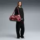 PUMA AT ESS GREEN TERRAINS Barrel Bag "Ruby Shimmer"